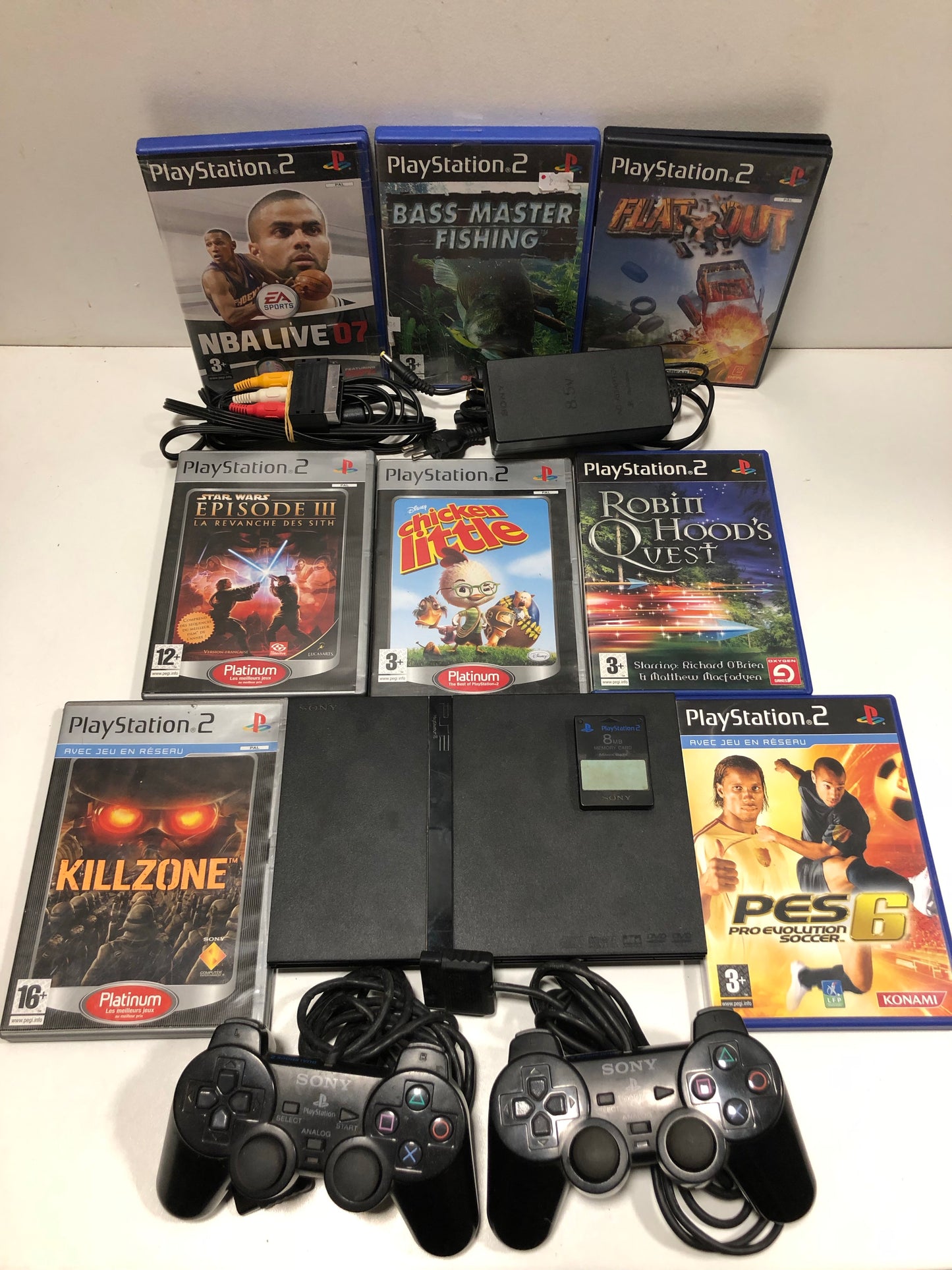 Sony PS2 slim + 2 manettes + 8 jeux +carte mémoire