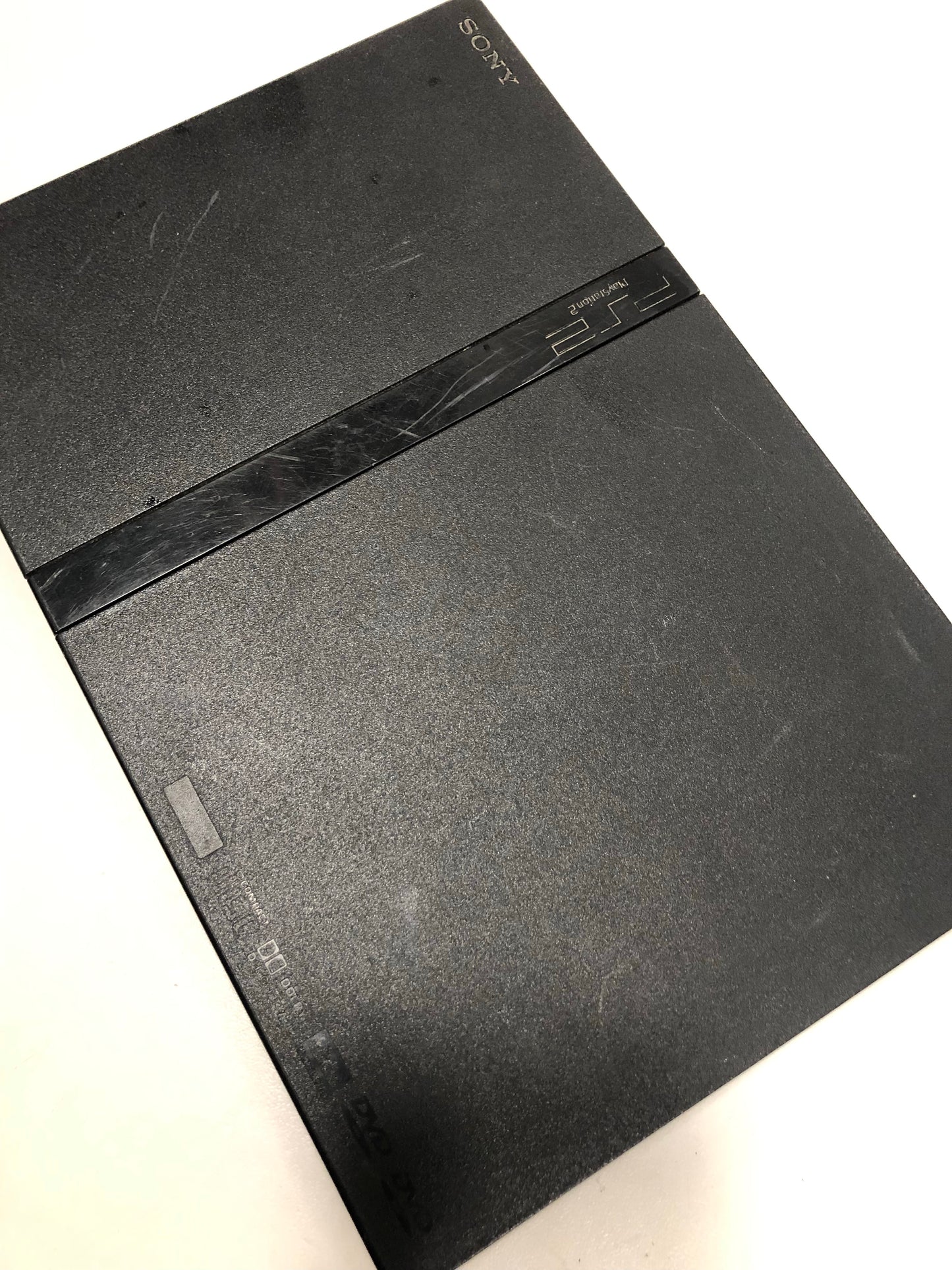 Sony PS2 slim + 2 manettes + 3 jeux + carte mémoire