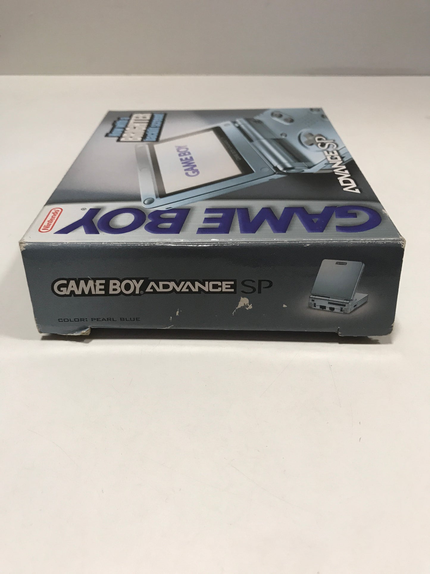 Nintendo Game boy advance sp pearl blue + 4 jeux + chargeur